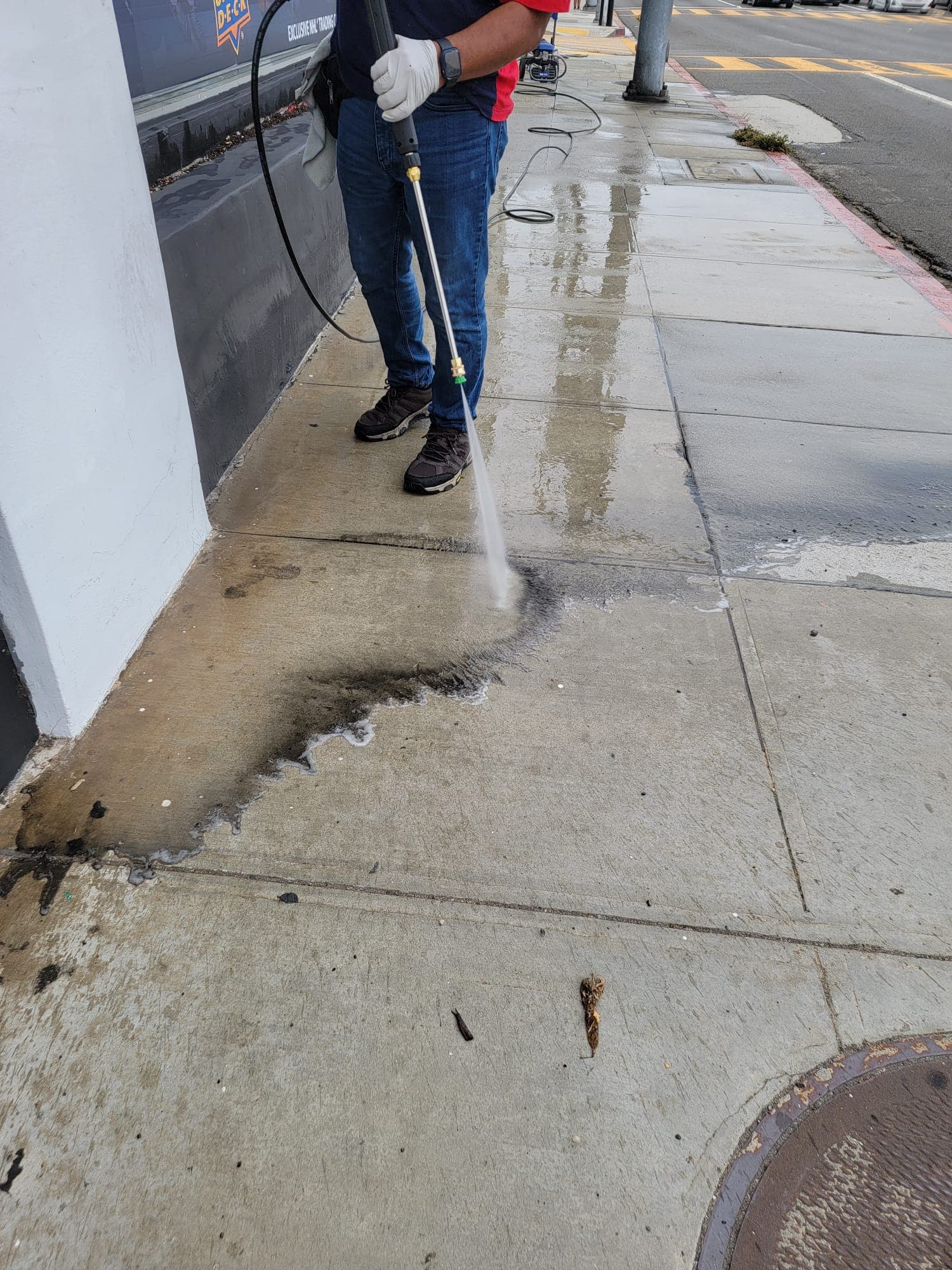 Pressure washing a Los Angeles sidewalk